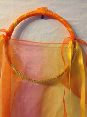 Fire Fabric Tabret with yellow and orange free flowing ribbon
